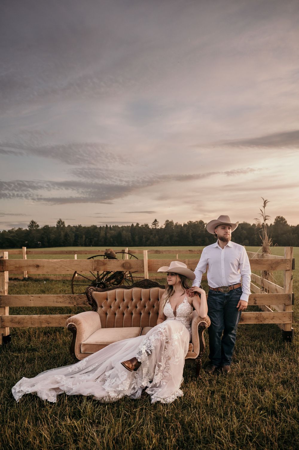 A romantic outdoor photo series shows a vintage brown couch in a grassy field at sunset with soft dramatic lighting.
