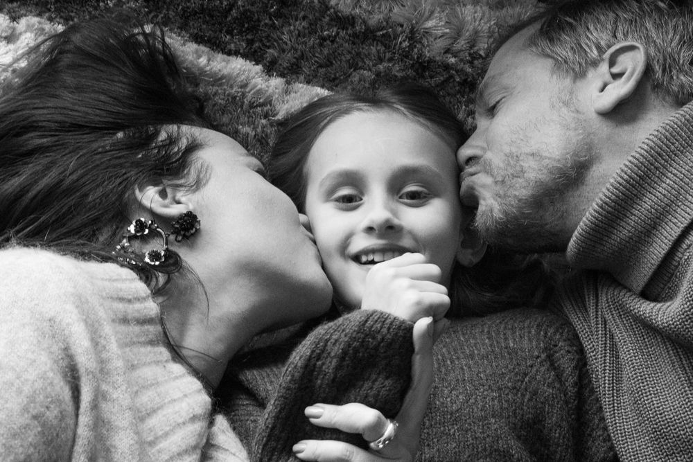Family on the carpet in a festive mood.