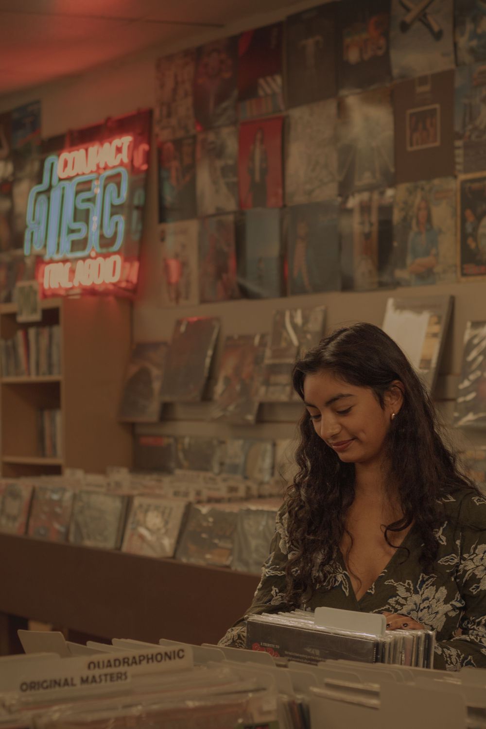 Highschool graduate enjoying vinyls at 4,000 holes record store in Spokane, WA for senior session.
