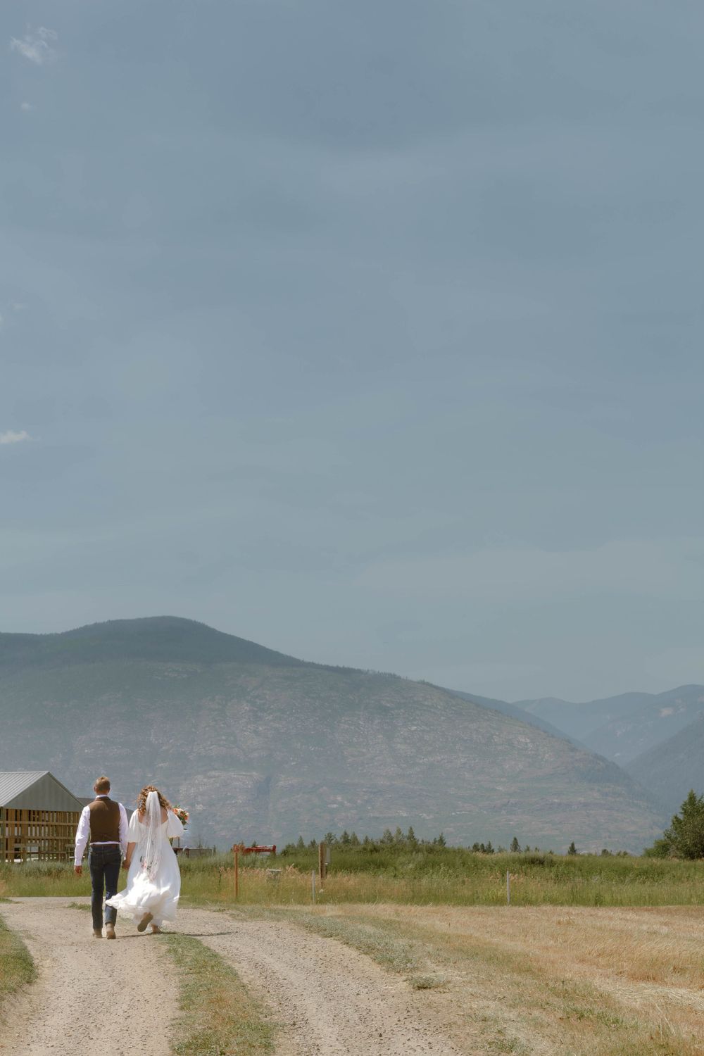 Bride and groom just married grand exit for backyard micro-wedding in Bonner's Ferry, Idaho.