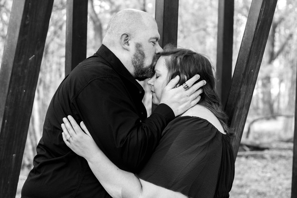 Couple smiling together during an authentic engagement session with Tay Portraits Chattanooga best photographer