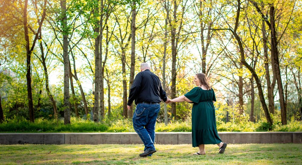 Couple smiling together during an authentic engagement session with Tay Portraits Chattanooga best photographer