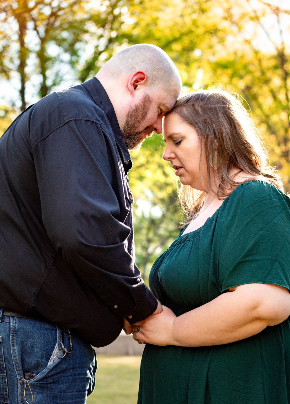 Couple smiling together during an authentic engagement session with Tay Portraits Chattanooga best photographer