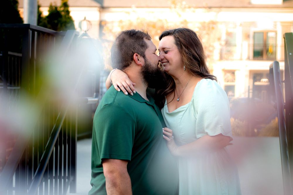 Couple smiling together during an authentic engagement session with Tay Portraits Chattanooga best photographer