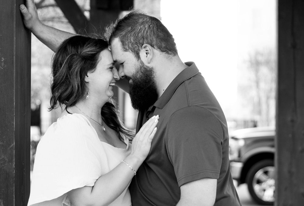 Couple smiling together during an authentic engagement session with Tay Portraits Chattanooga best photographer