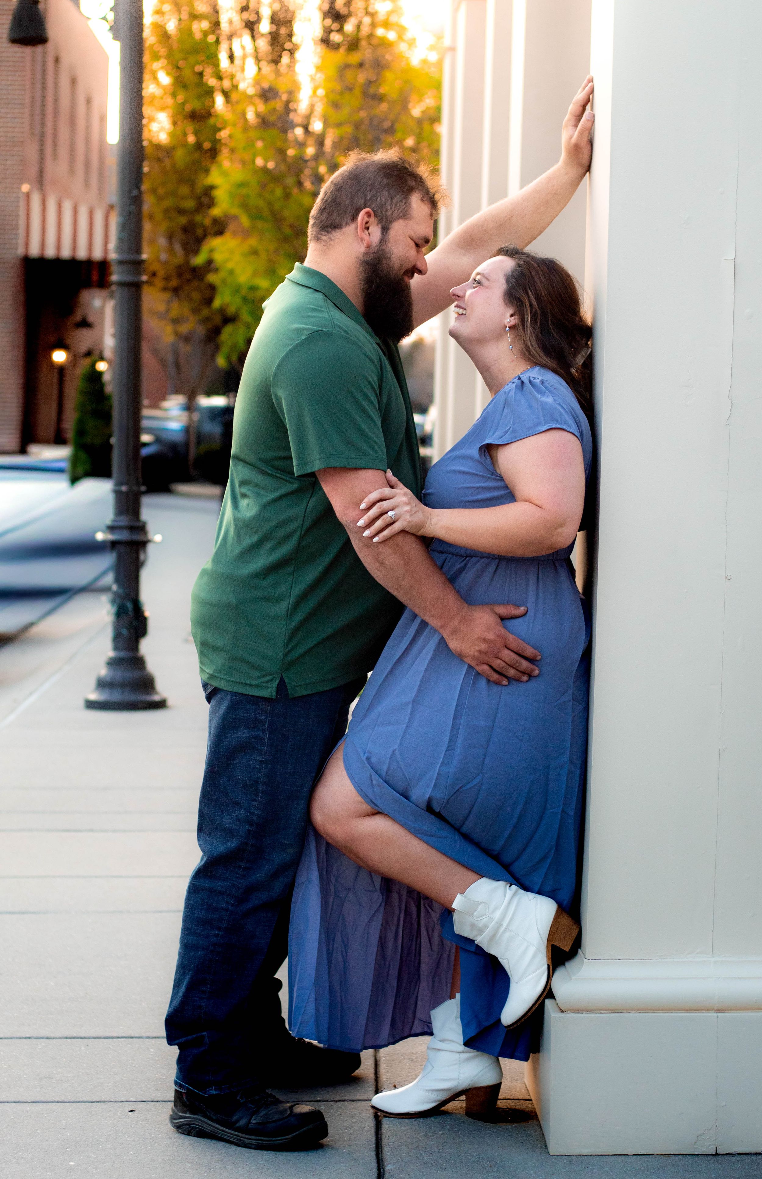 Couple smiling together during an authentic engagement session with Tay Portraits Chattanooga best photographer