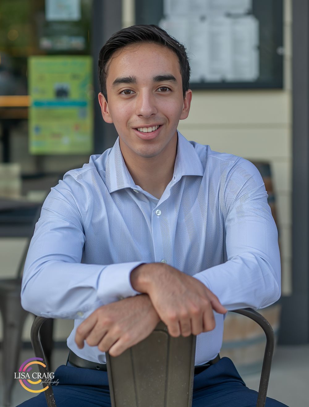 Professional seated portrait of person in light blue dress shirt. Senior Portrait Photographer | Denver, Broomfield, Boulder