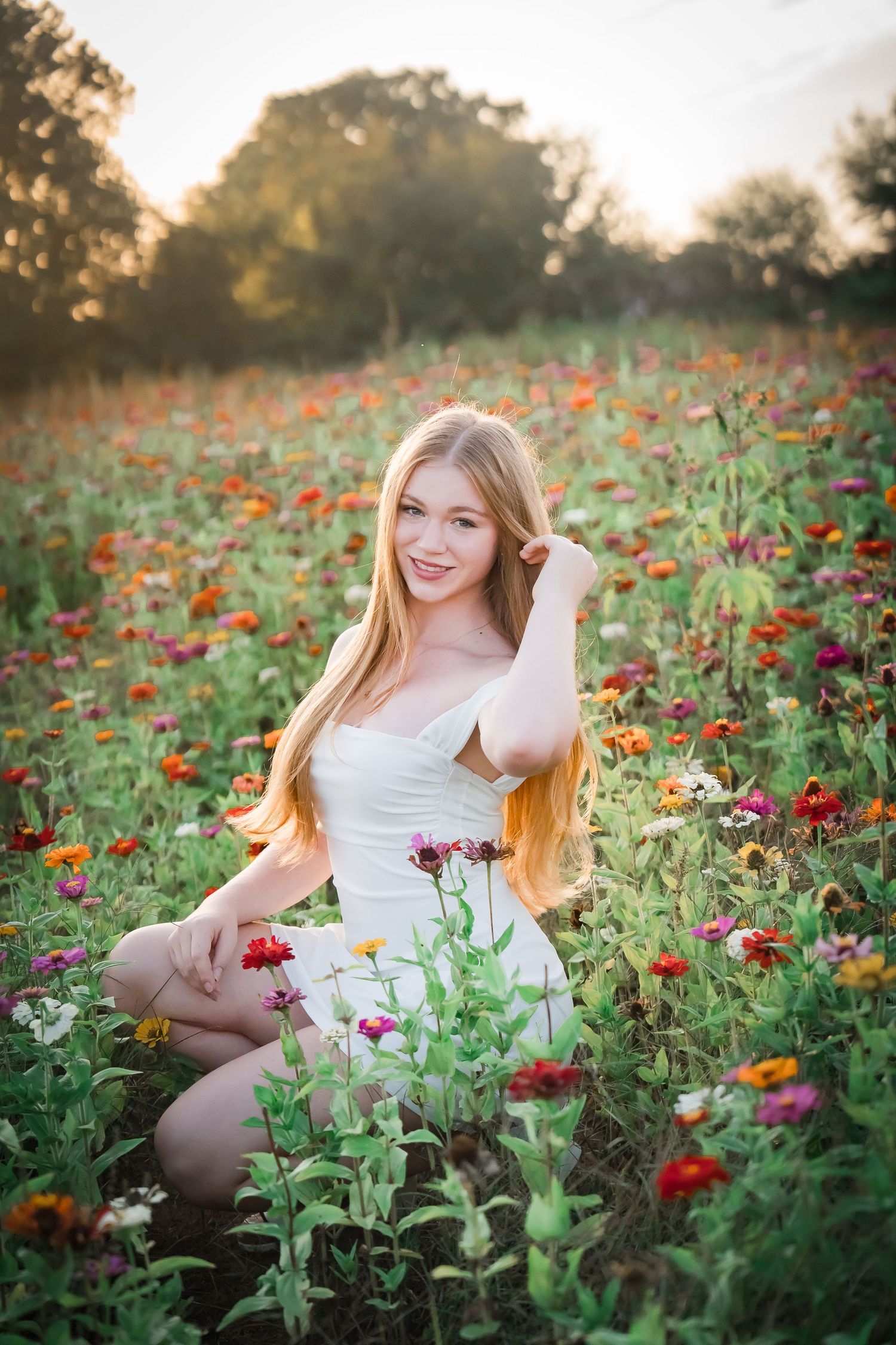 Portrait of someone in black and striped skirt on bridge during sunset.