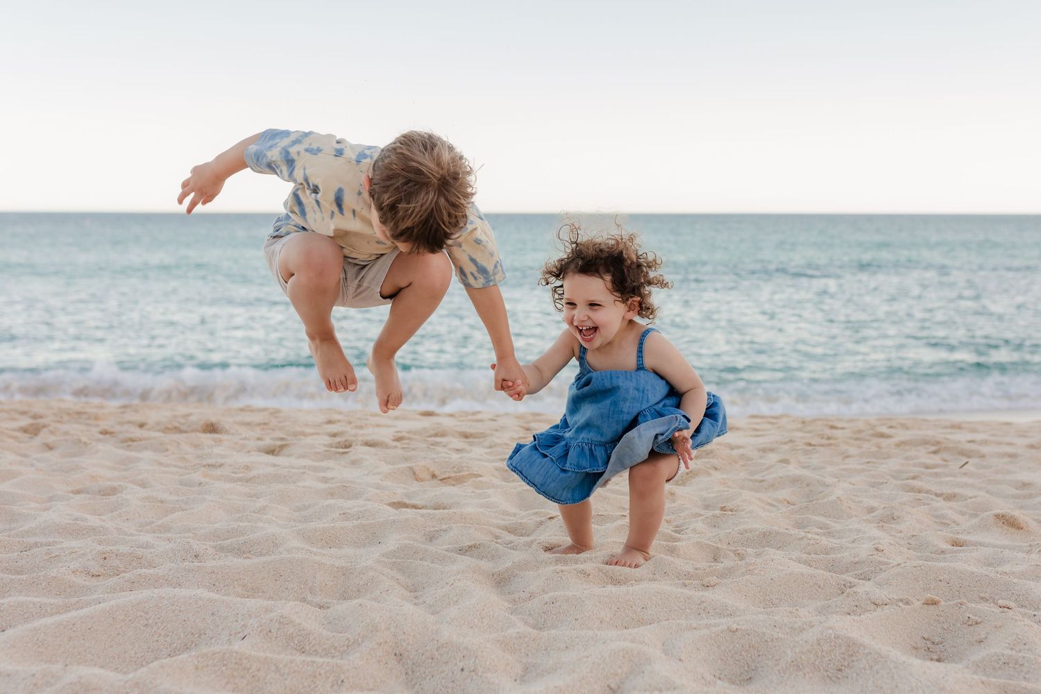 Kids playing on the sand in Los Cabos