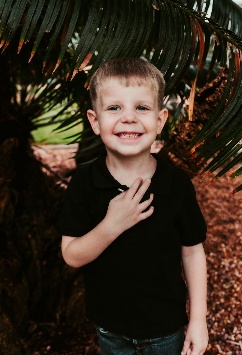 Outdoor Headshot Session Gisela Kopsick Arboretum in Saint Petersburg, FL; Young boy posing near palms