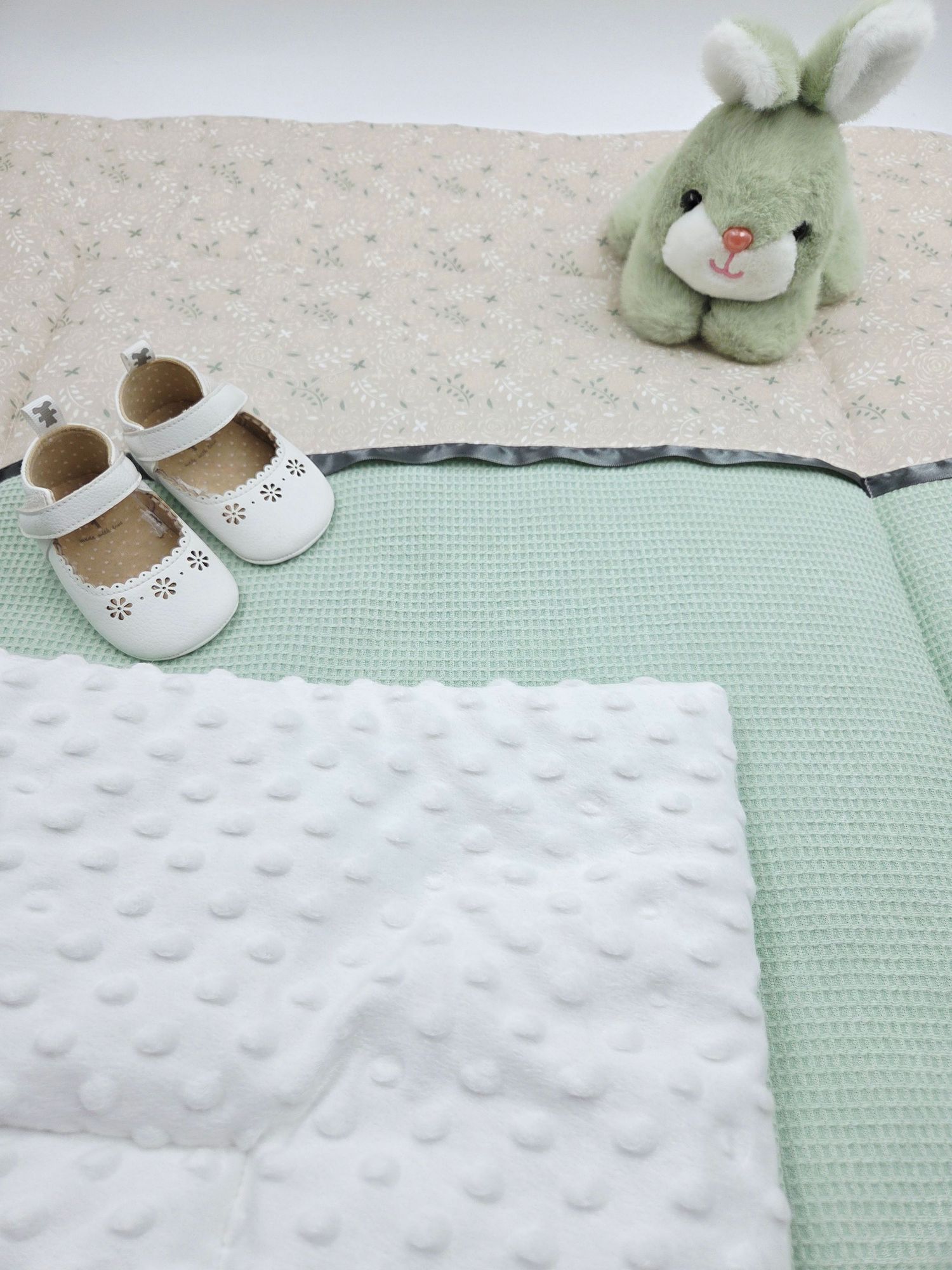 White minky dot blanket paired with mint green waffle texture fabric.