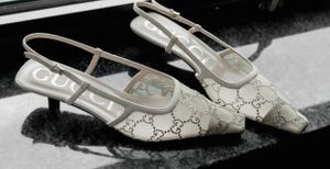 Designer slingback shoes with monogram pattern and silver buckle detail.