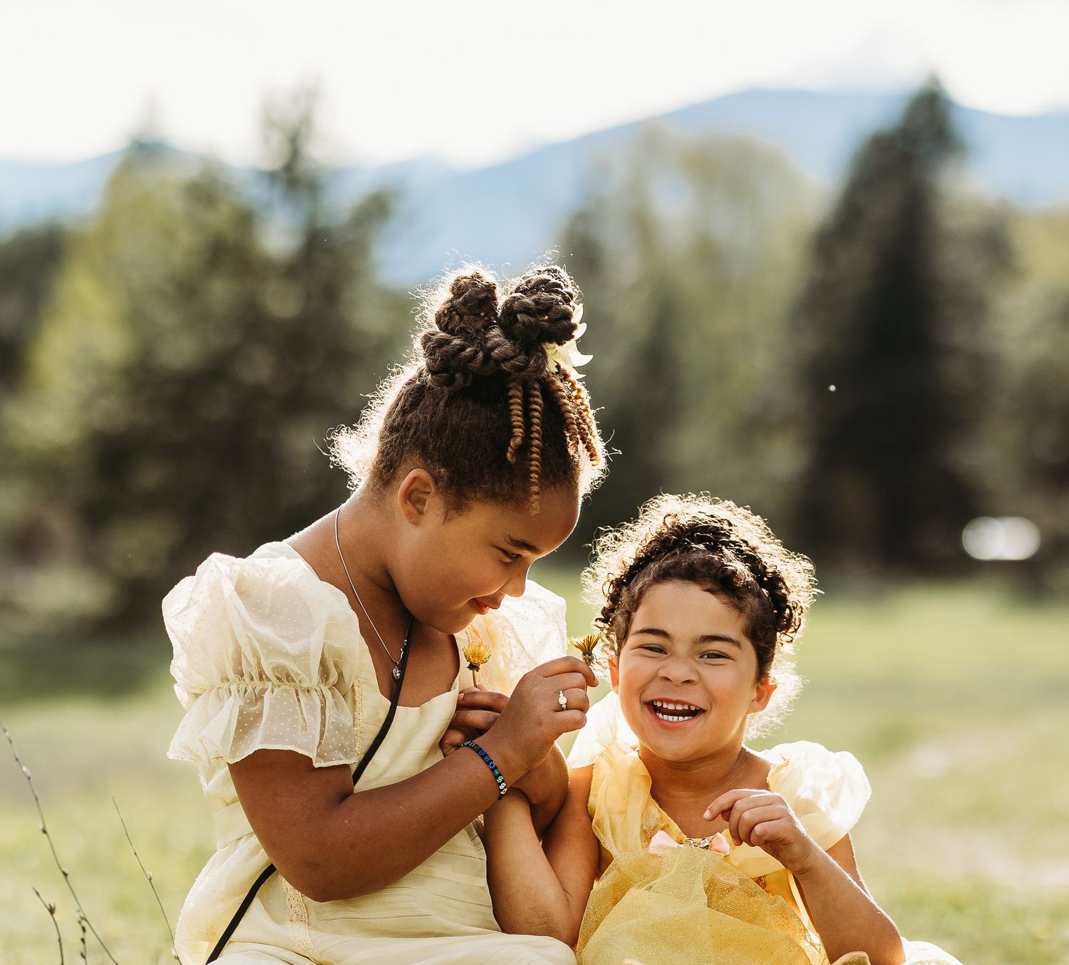 Two girls in a sunny field