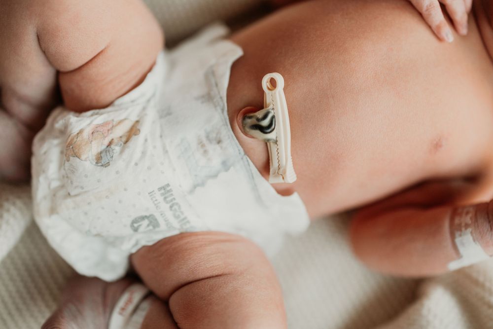 Gentle close-up shot of newborn baby details with soft natural lighting.