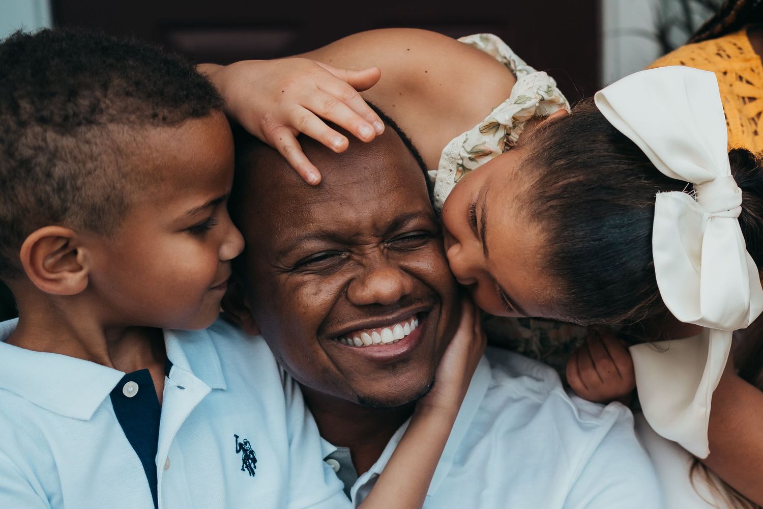 A heartwarming sequence of candid family moments showing joyful laughter and embraces.