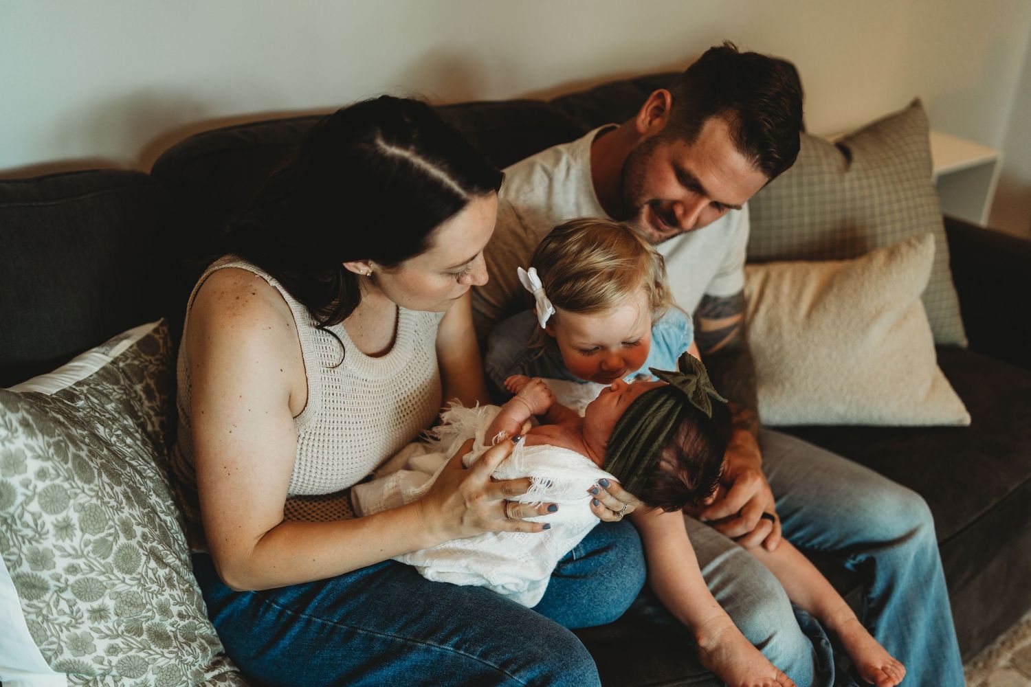 Candid family interaction captured in a series of relaxed poses on a comfortable couch.