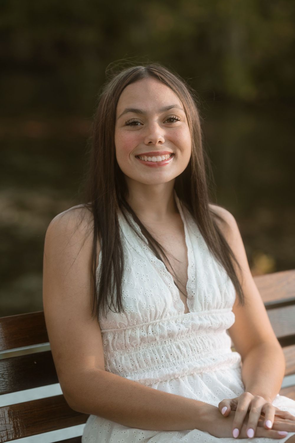 A series of candid photos showing a person in a white lace dress sitting on a bench outdoors.