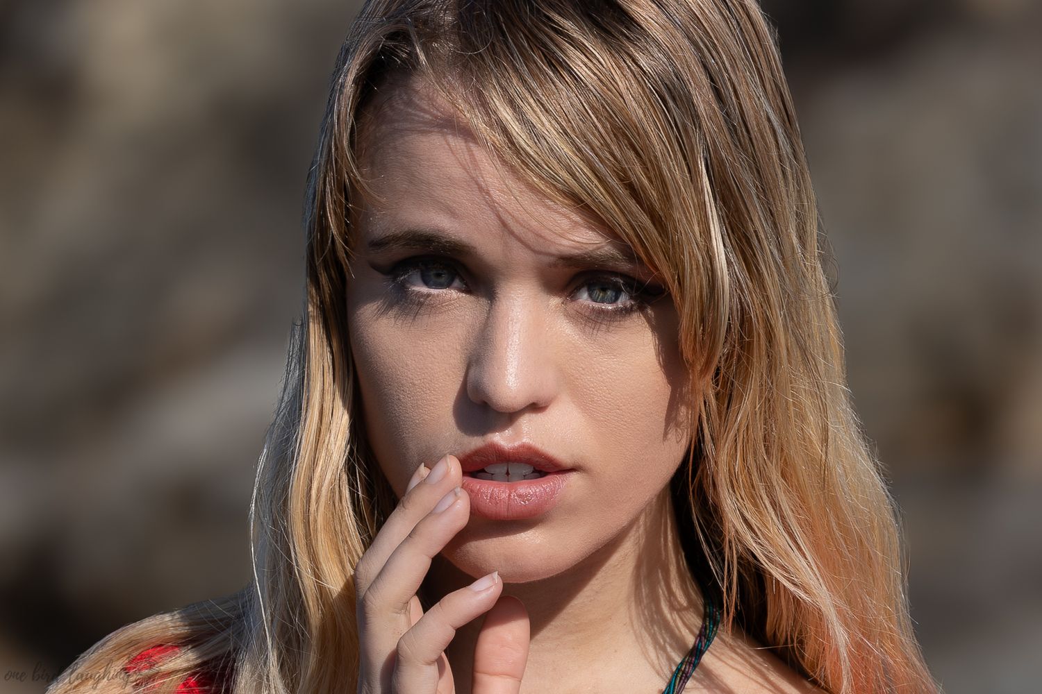 Female beach headshot photo shoot taken at Gold Coast Queensland by One Bird Laughing portrait photography