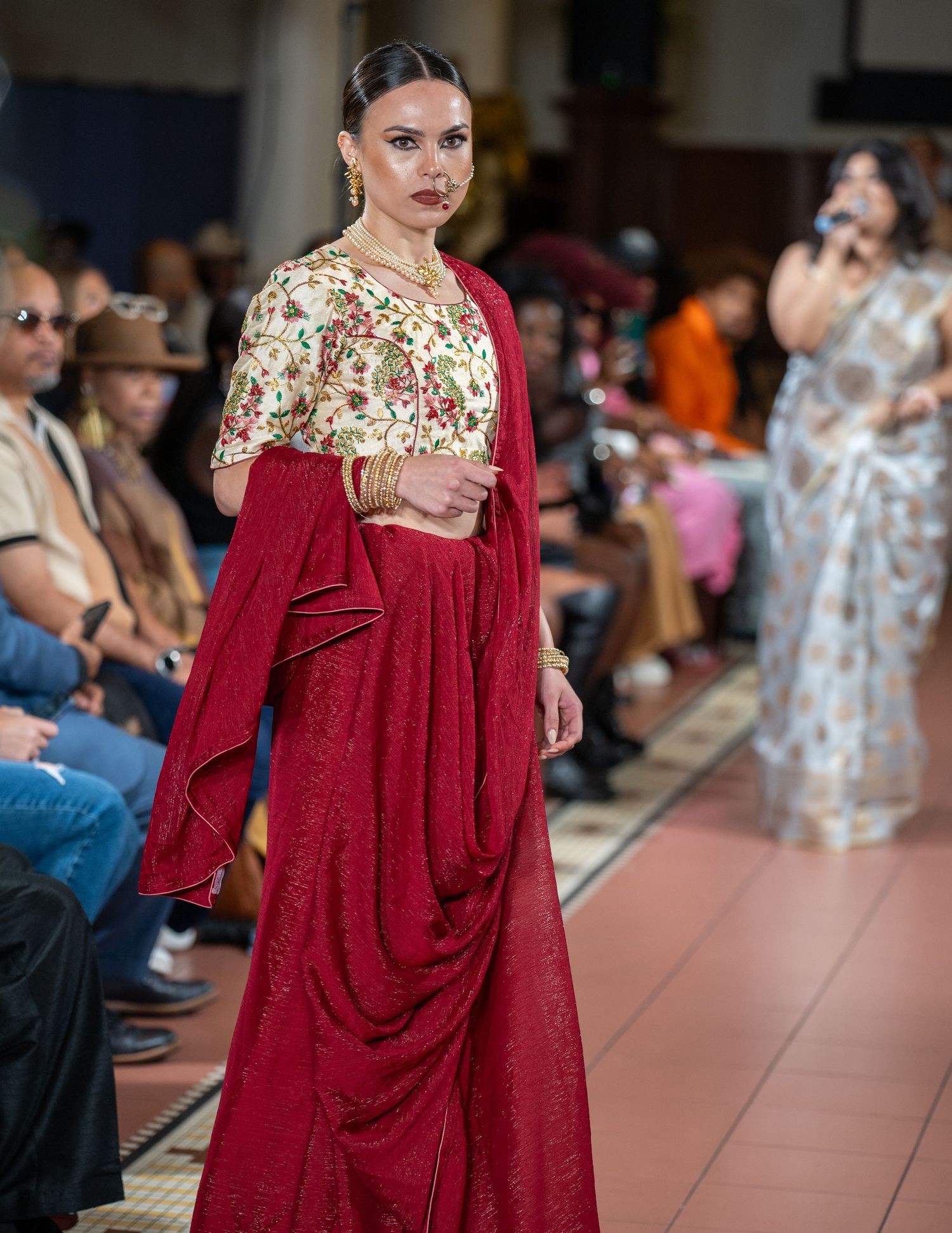 Elegant red and floral fashion design featuring draped fabric and traditional styling.