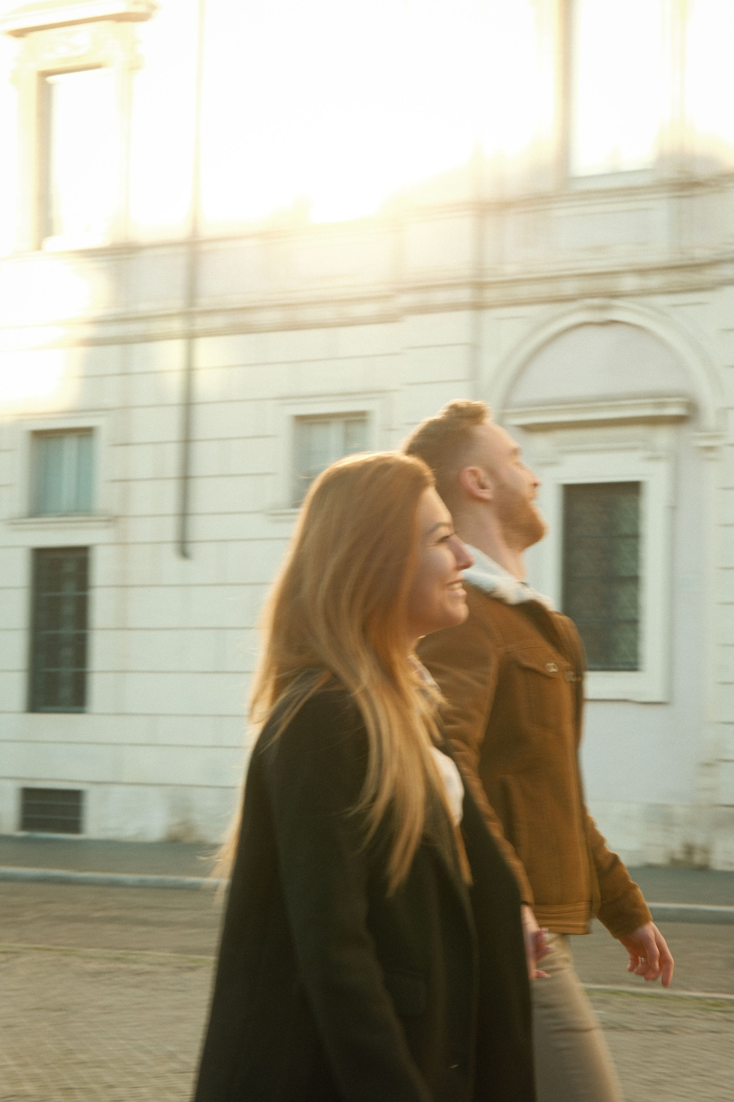 A joyful moment shared in front of classic Italian architecture.
