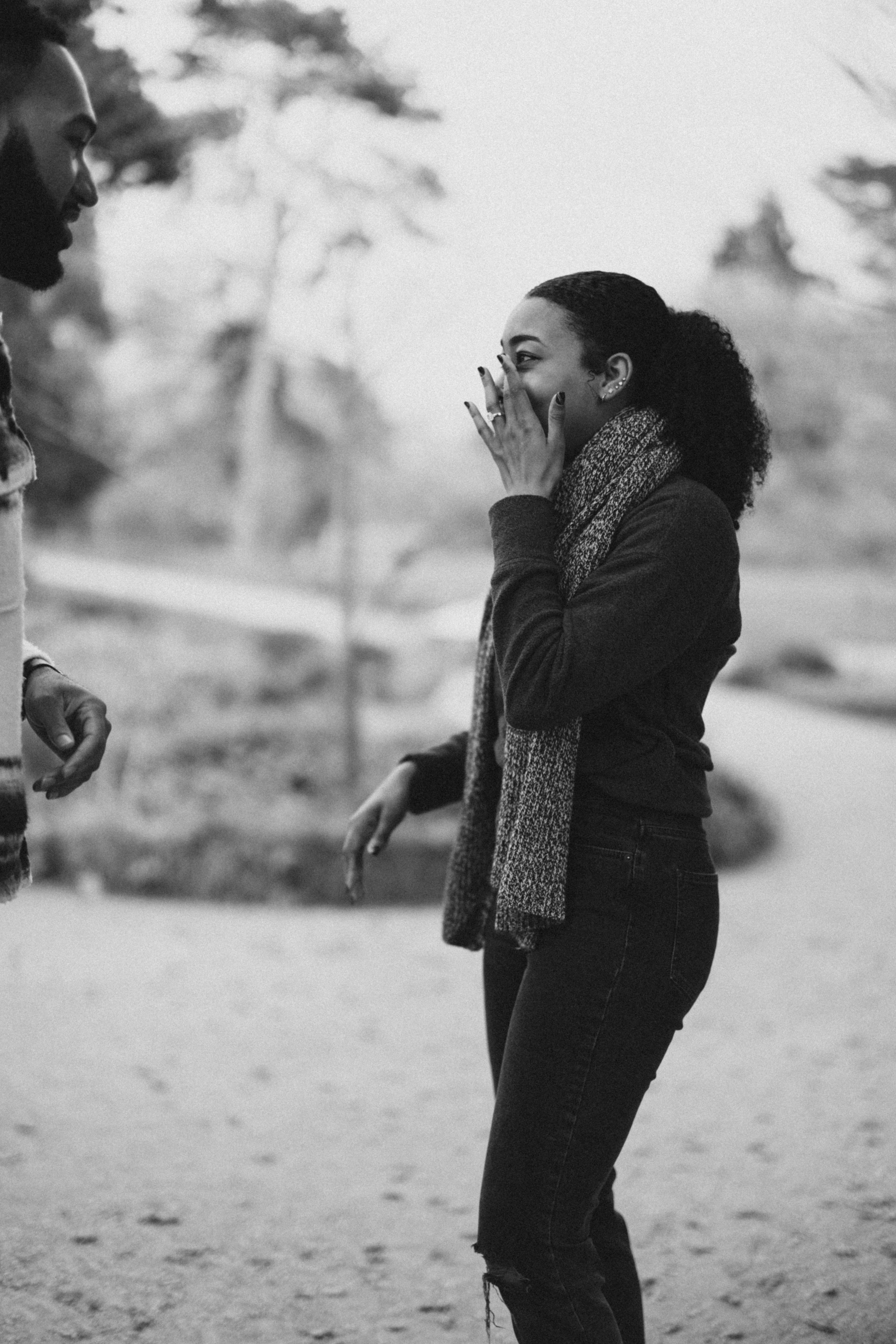 Black and white photo of surprise reaction in an outdoor setting.