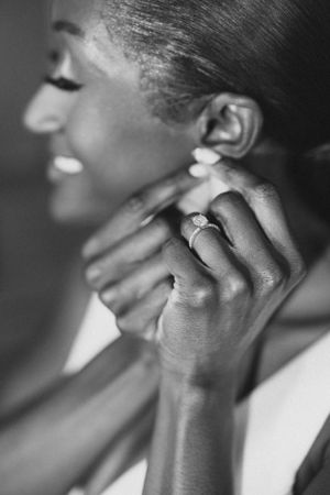 Close-up portrait of bride in classic white V-neck wedding gown.