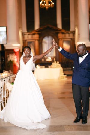 A celebratory moment between a couple in wedding attire on their special day.