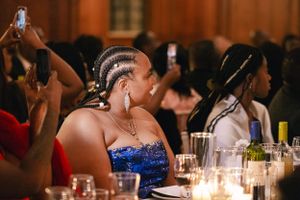 Wedding reception guest in blue dress enjoying the celebration.