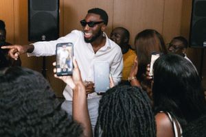 Lively dance party scene at a wedding reception celebration.