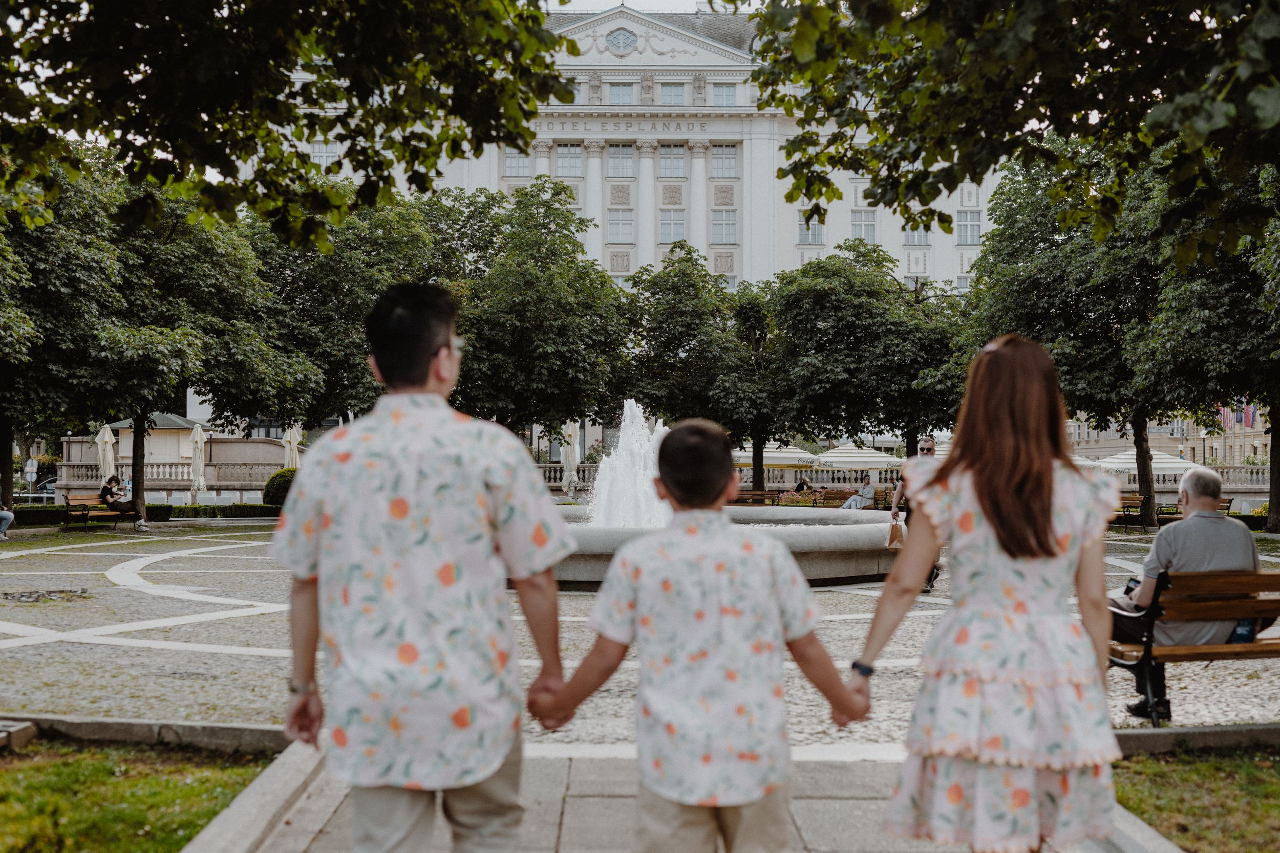 Child leading the way as the family explores the historic sights of Upper Town during their Zagreb vacation photoshoot.