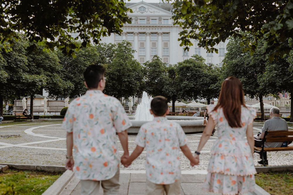 Child leading the way as the family explores the historic sights of Upper Town during their Zagreb vacation photoshoot.