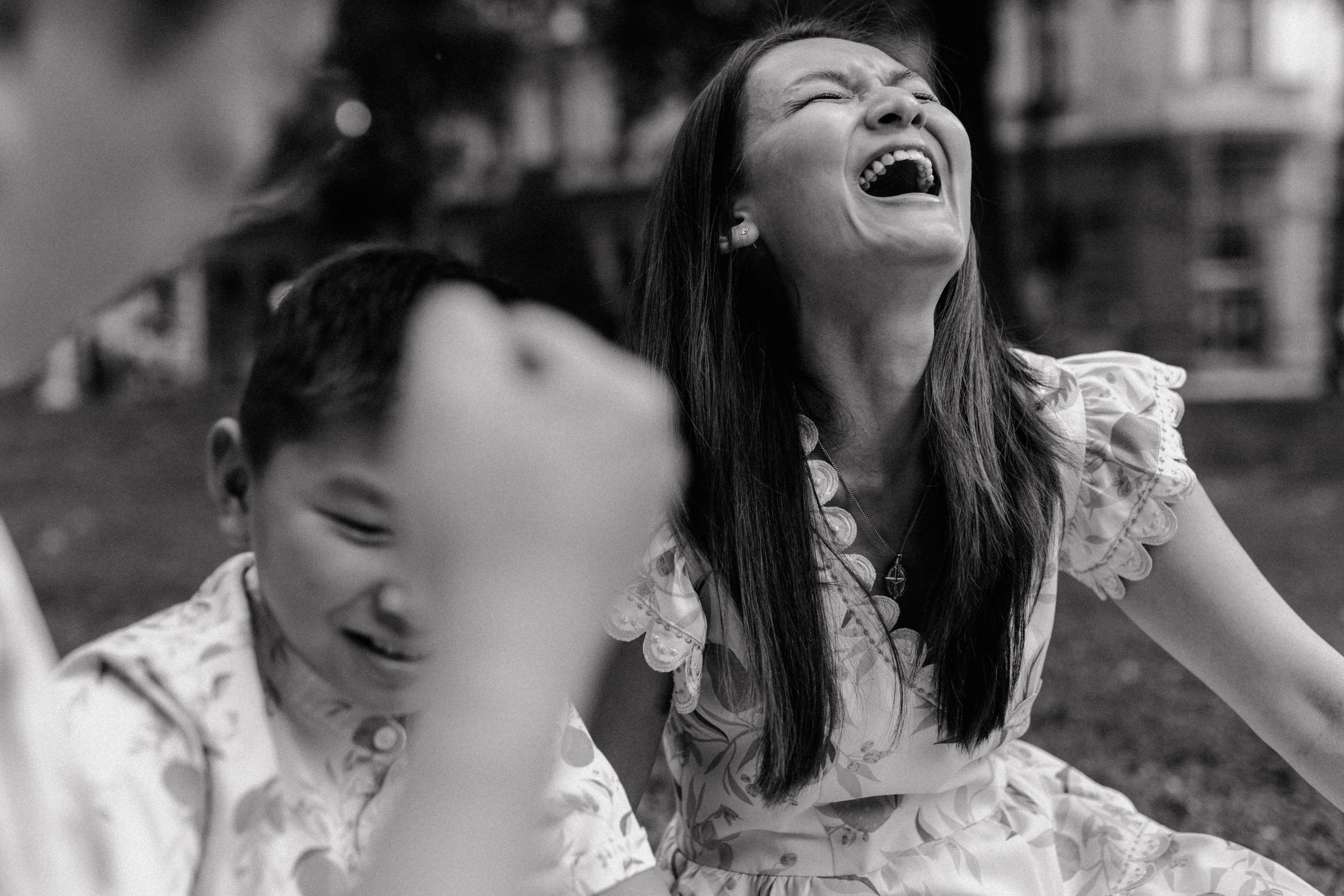 The family of three sharing a laugh during their photoshoot, capturing the joy of their vacation in Zagreb.
