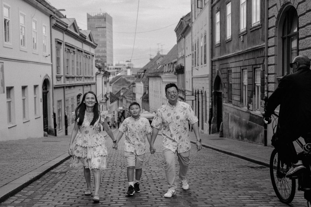 The family strolling down a cobblestone street in Zagreb during their vacation photoshoot.