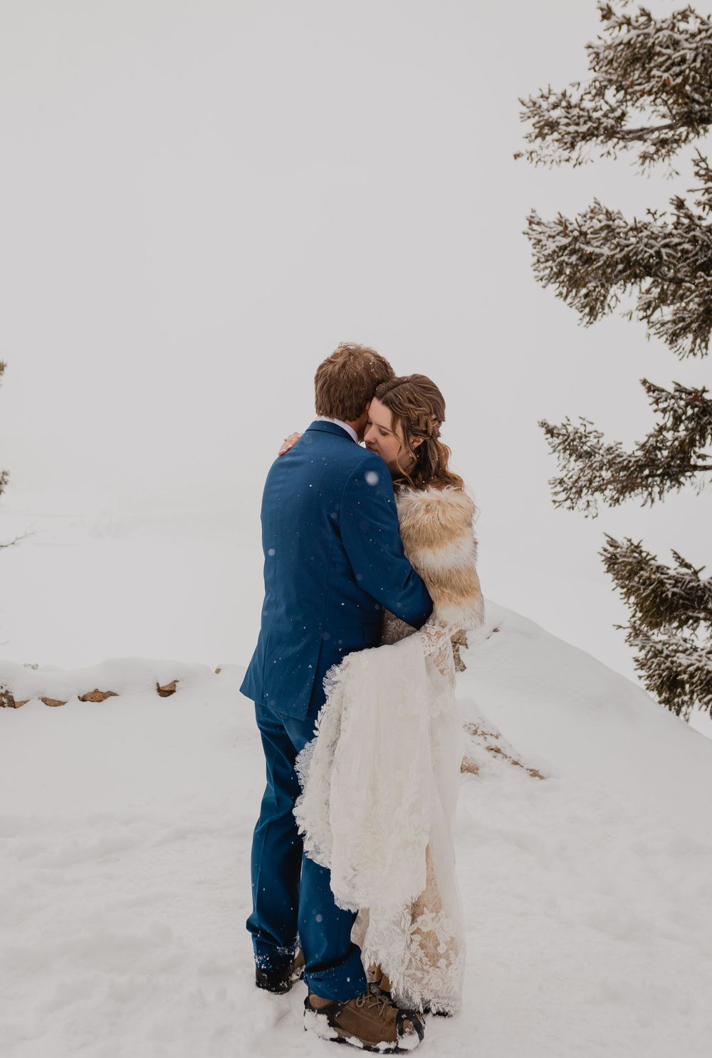 Couple's joyful moment of exchanging vows surrounded by Breckenridge's snowy beauty
