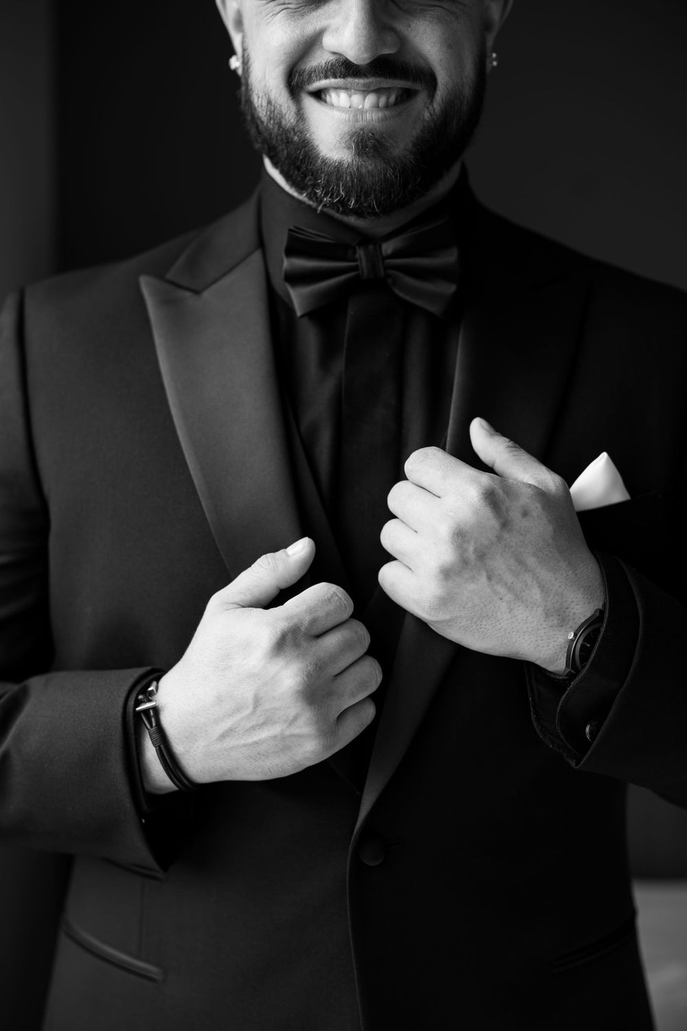 Black and white portrait of formal attire with bow tie and suit jacket.
