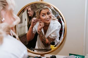 A collage of mirror reflections showing people getting ready and smiling in a bright indoor setting.