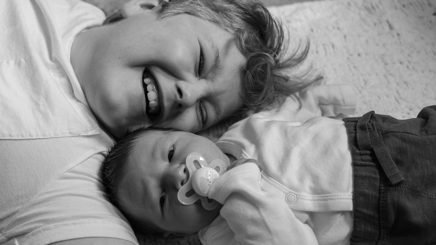 newborn baby with his big brother in an in-home newborn photo session in edinburgh scotland