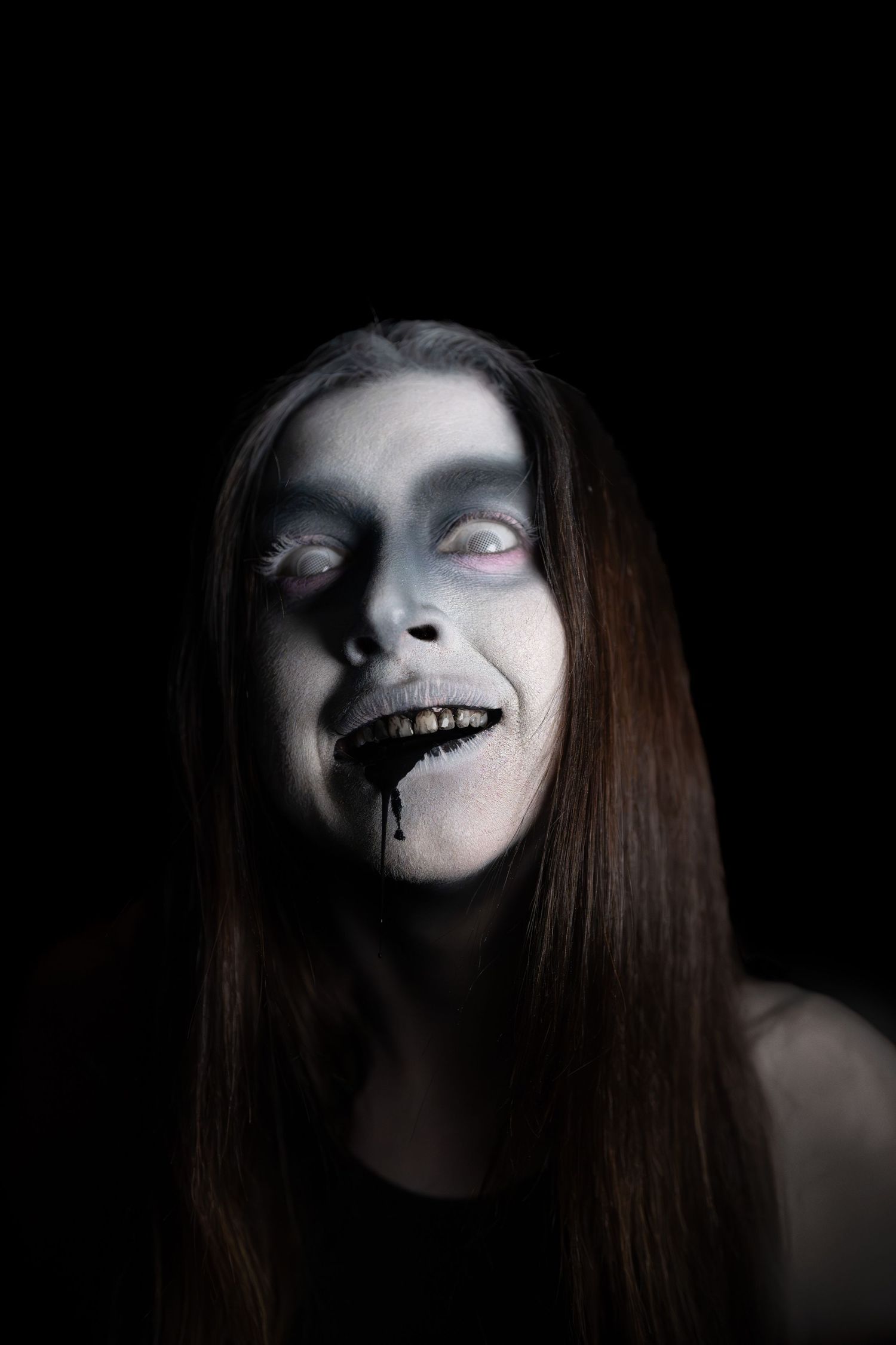 Creepy ghost with black liquid coming out of its mouth.