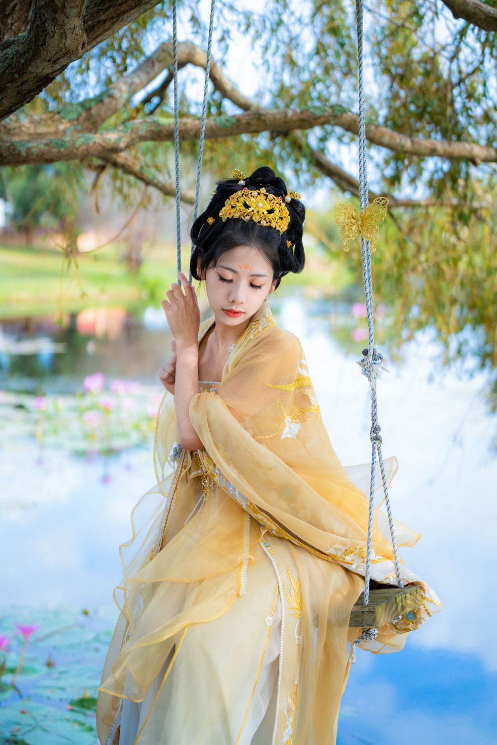 Elegant golden Hanfu portrait by a tranquil water lily lake inspired by Monet's Garden in North Shore, by Imagine Image Studio.