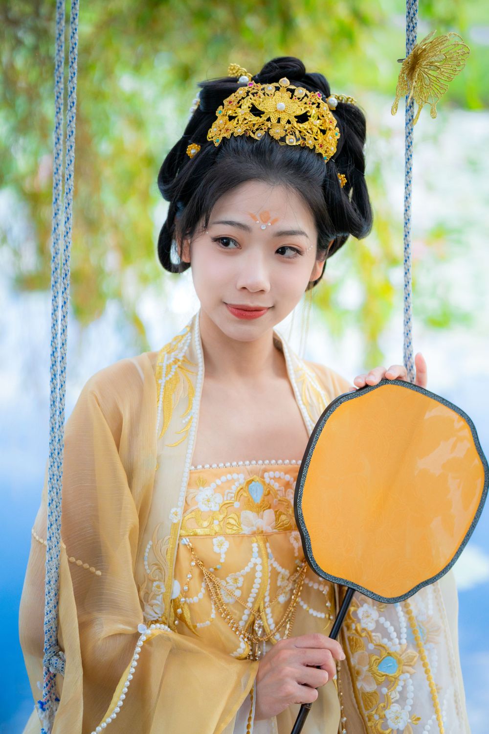 Serene solo portrait in a glowing golden Hanfu by a tranquil North Shore water lily lake, by Auckland photographer Imagine Image Studio.