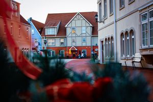 Row of traditional European-style houses with distinctive architecture and colorful facades.
