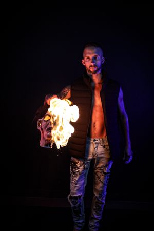 Fire manipulation performance shown in progressive shots with dramatic lighting.