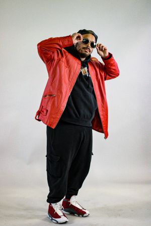Urban fashion photography featuring red jacket and sunglasses with dramatic poses.