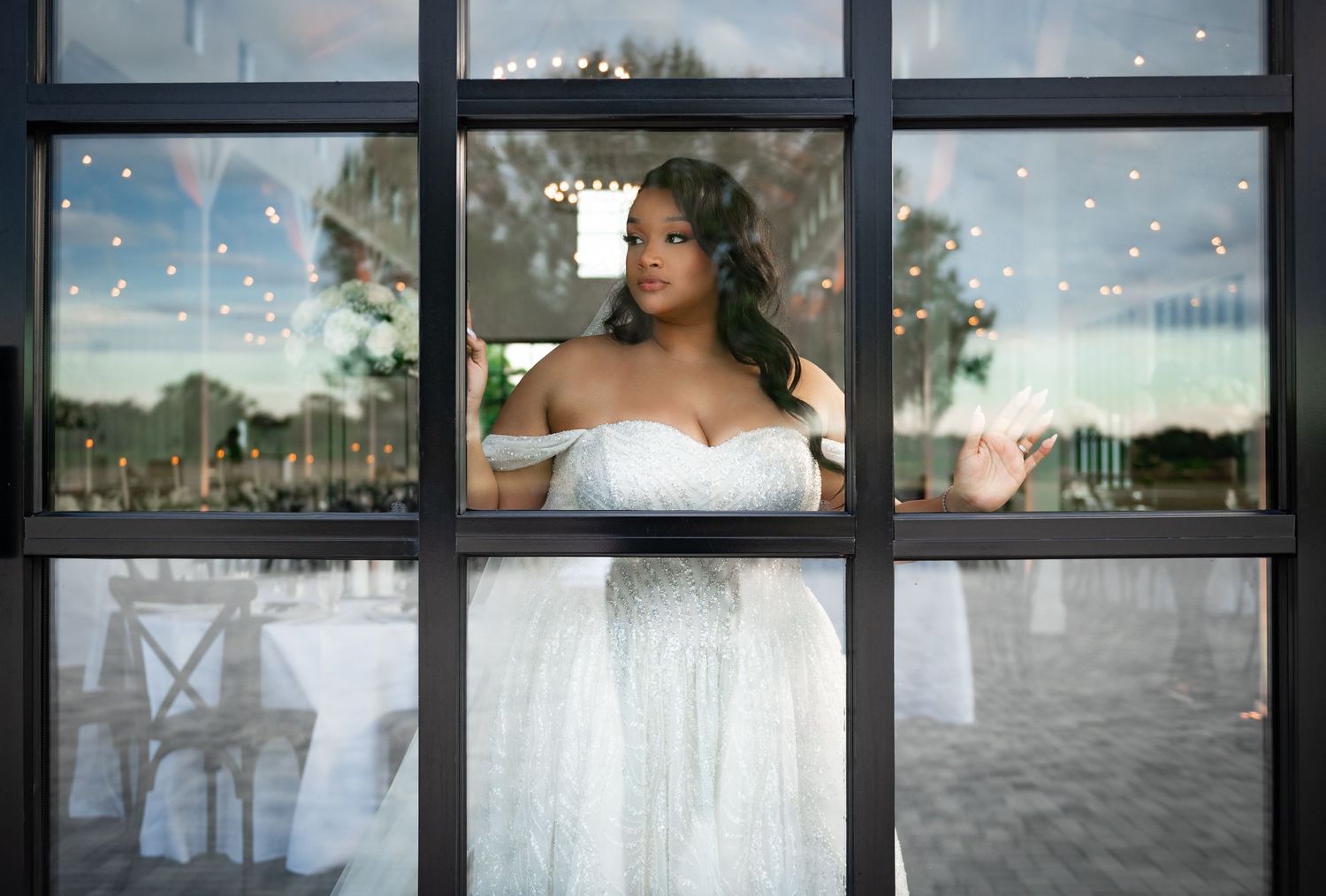 South Florida Premier Wedding Photographers captured this beautiful bride looking out of the window during her bridal portrait session.