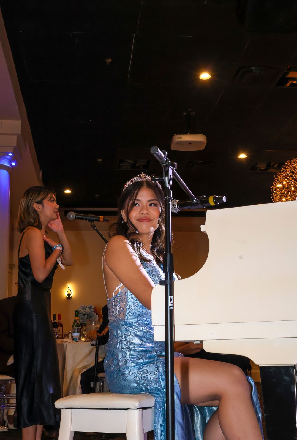 Girl sitting at piano