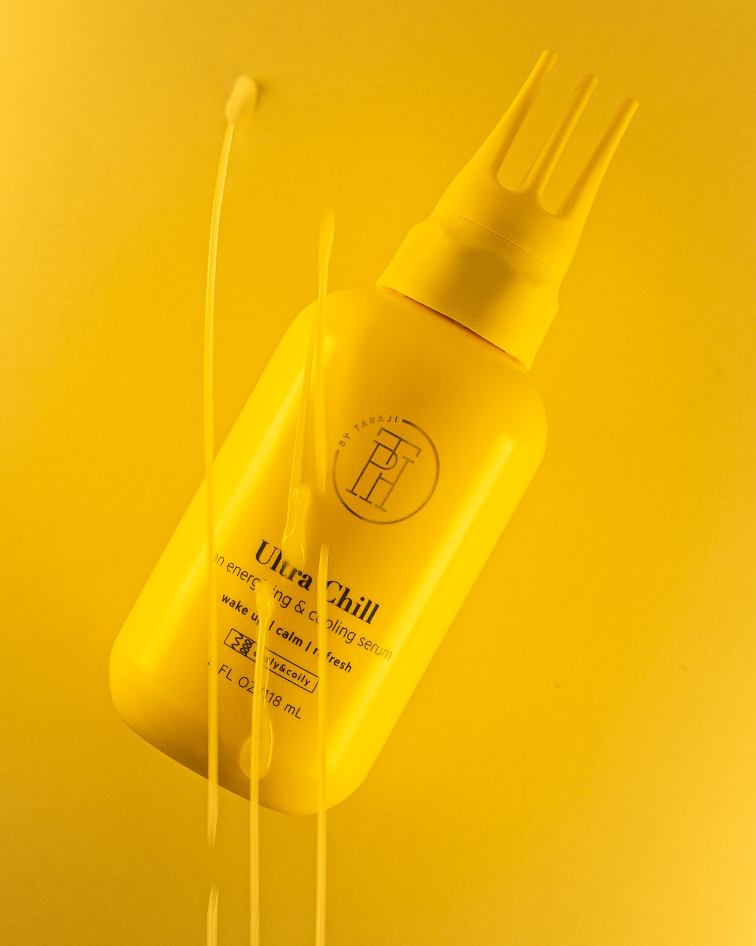 Ultra Chill hair product bottle tilted at an angle with swooshing design elements on yellow background.