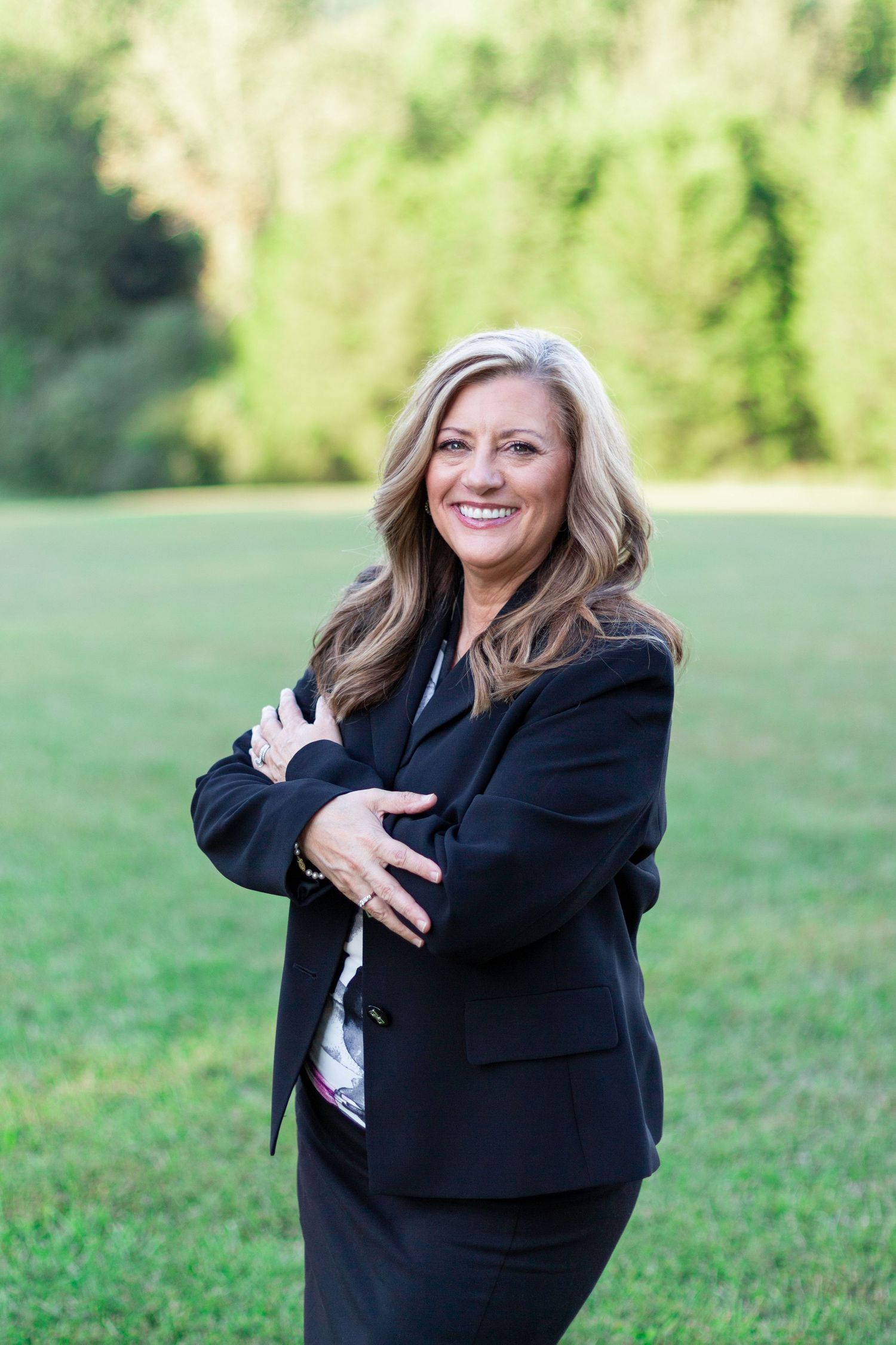 Woman smiling at the photo for a business headshot
