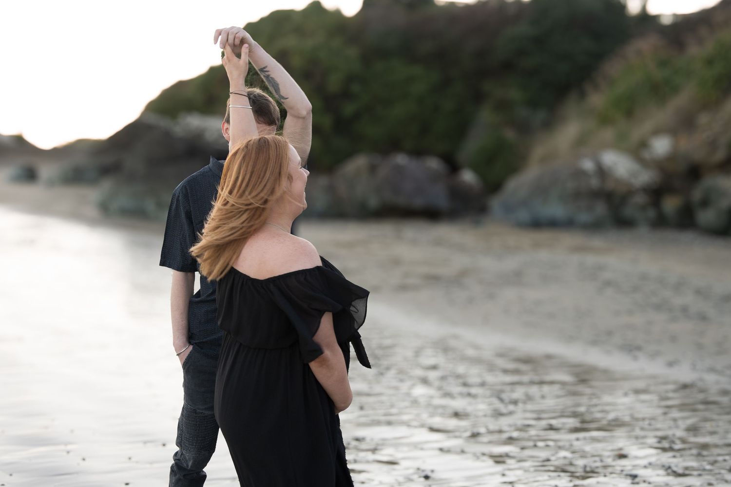 loving couple dancing at beach