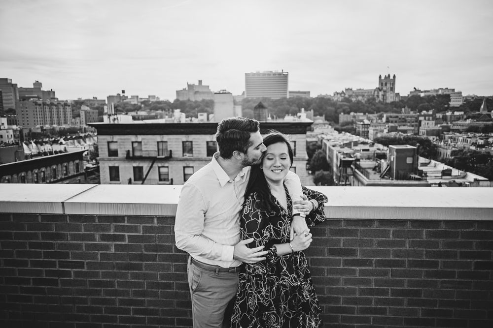 Black and white cityscape panorama showing rooftops and buildings.