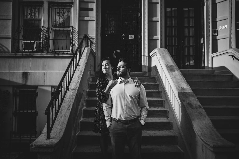 A black and white portrait session on classic brownstone steps.